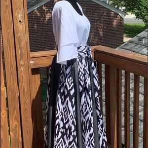 A maxi skirt and a white quarter sleeve top